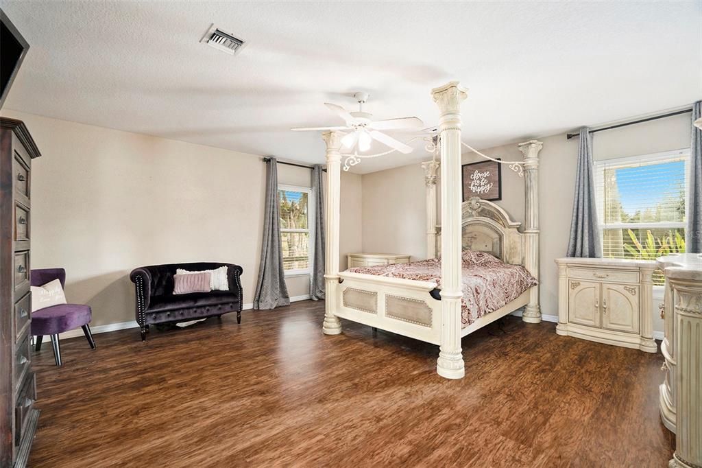 7309 Quail Meadow Road Plant City, FL 33565 - Photo 12 of 24 a living room with furniture and a wooden floor