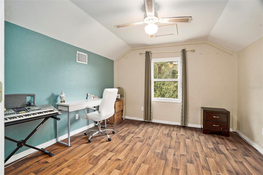 7309 Quail Meadow Road Plant City, FL 33565 - Photo 21 of 24 a workspace with wooden floor