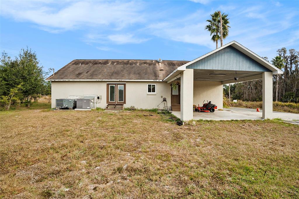 7309 Quail Meadow Road Plant City, FL 33565 - Photo 3 of 24 a view of a house with a yard