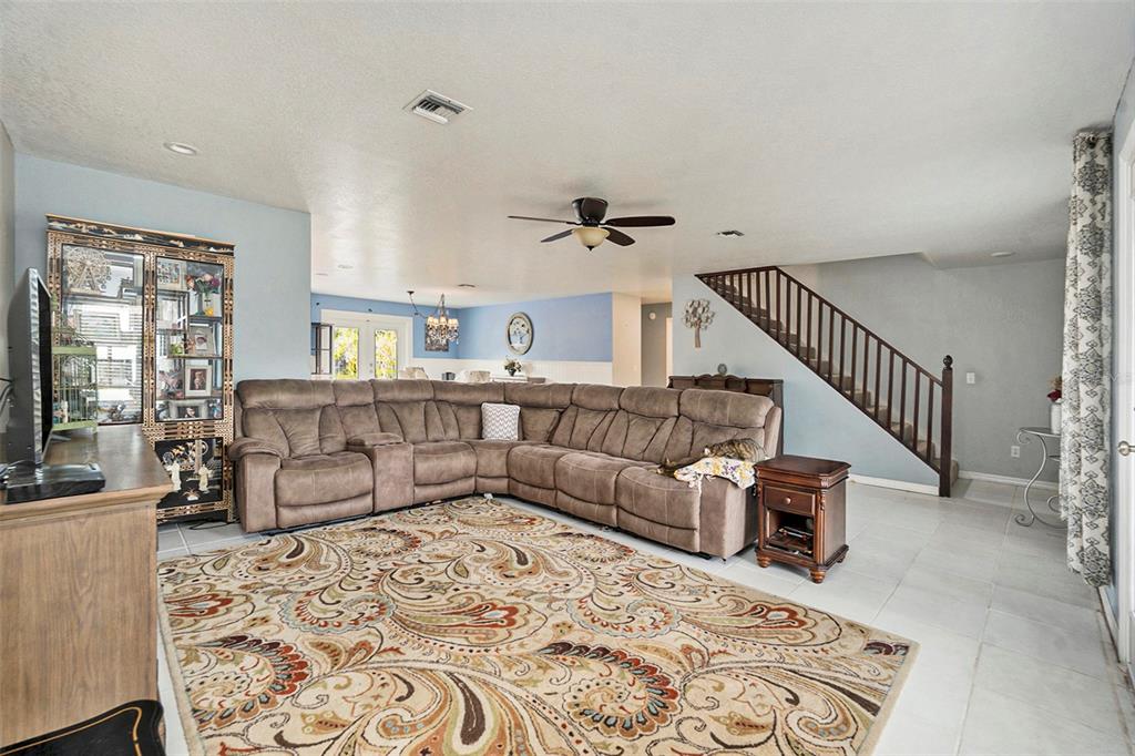 7309 Quail Meadow Road Plant City, FL 33565 - Photo 9 of 24 a living room with furniture rug and a table