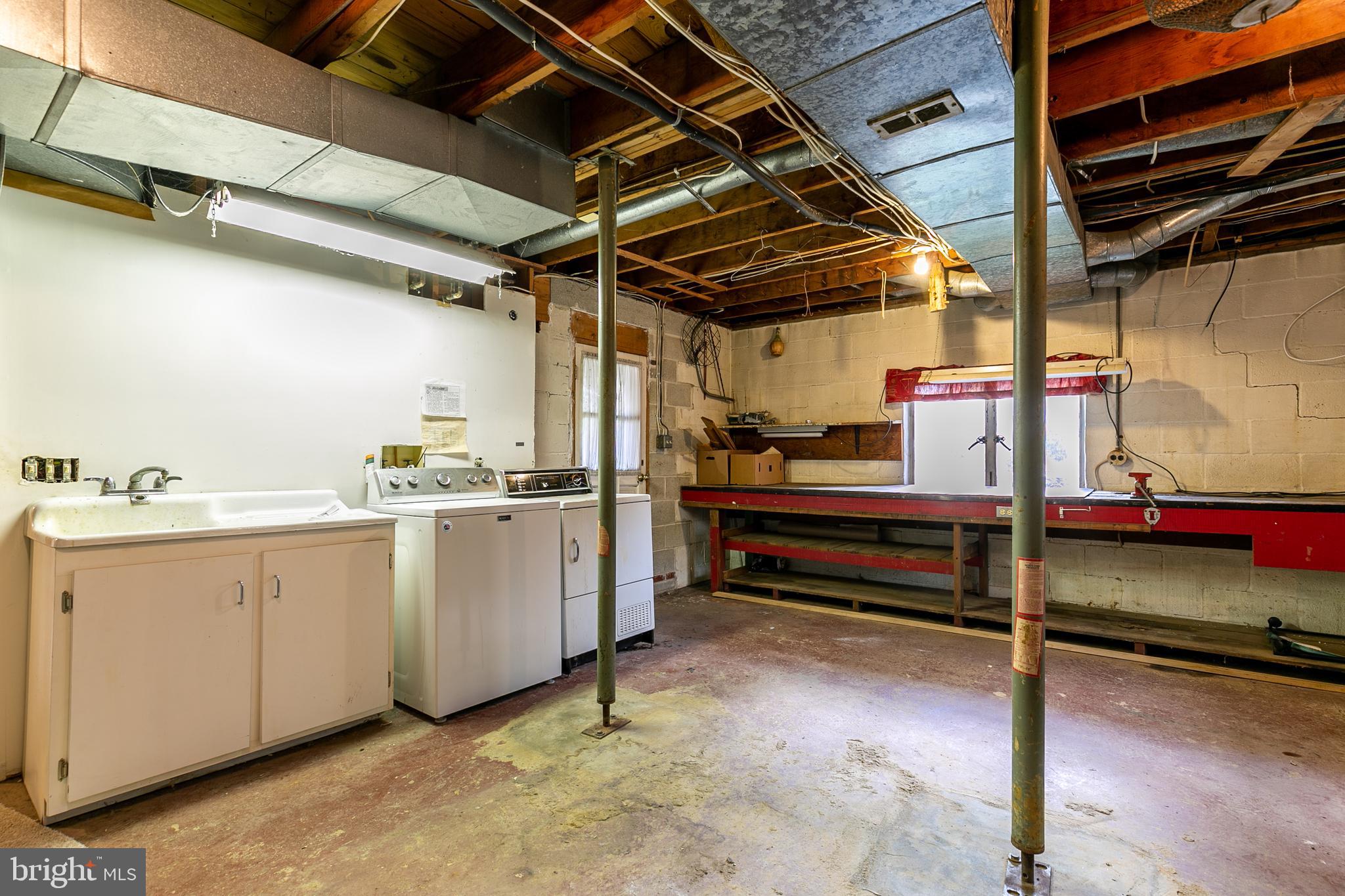 1432 Ravine Way Arnold, MD 21012 - Photo 36 of 50 Basement work bench and separate entrance.