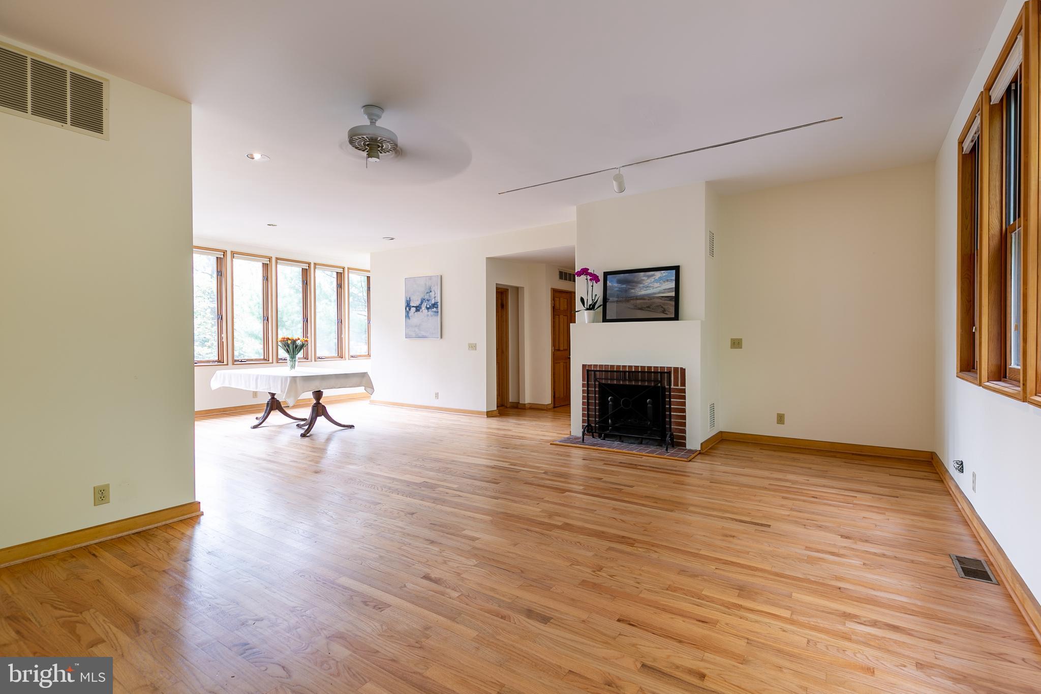 1432 Ravine Way Arnold, MD 21012 - Photo 8 of 50 Living area w/wood burning FP and 9ft ceilings.