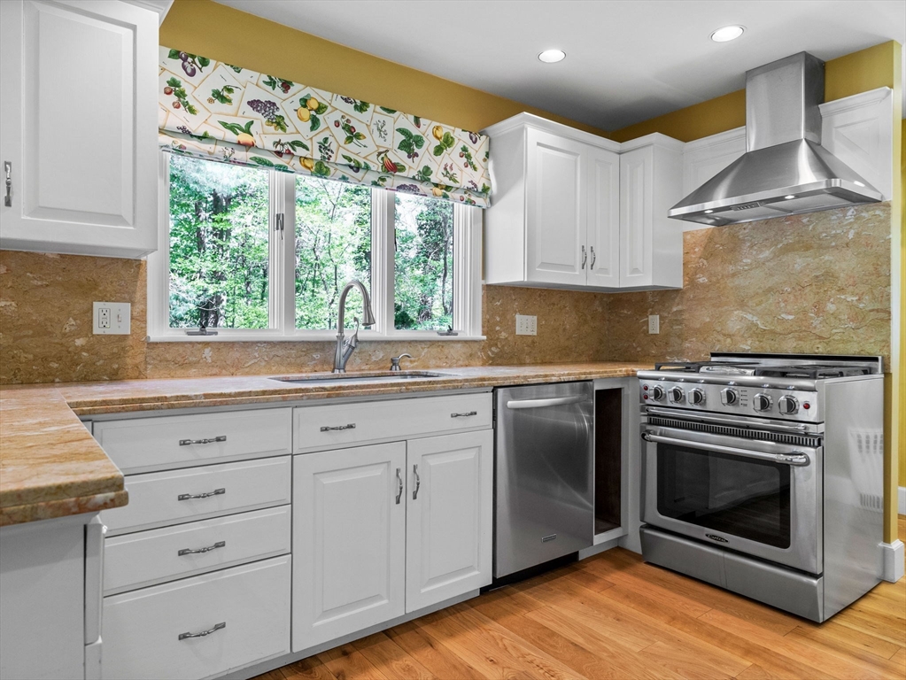 81 Garden Road Wellesley, MA 02481 - Photo 5 of 17 a kitchen with granite countertop a sink stainless steel appliances and cabinets