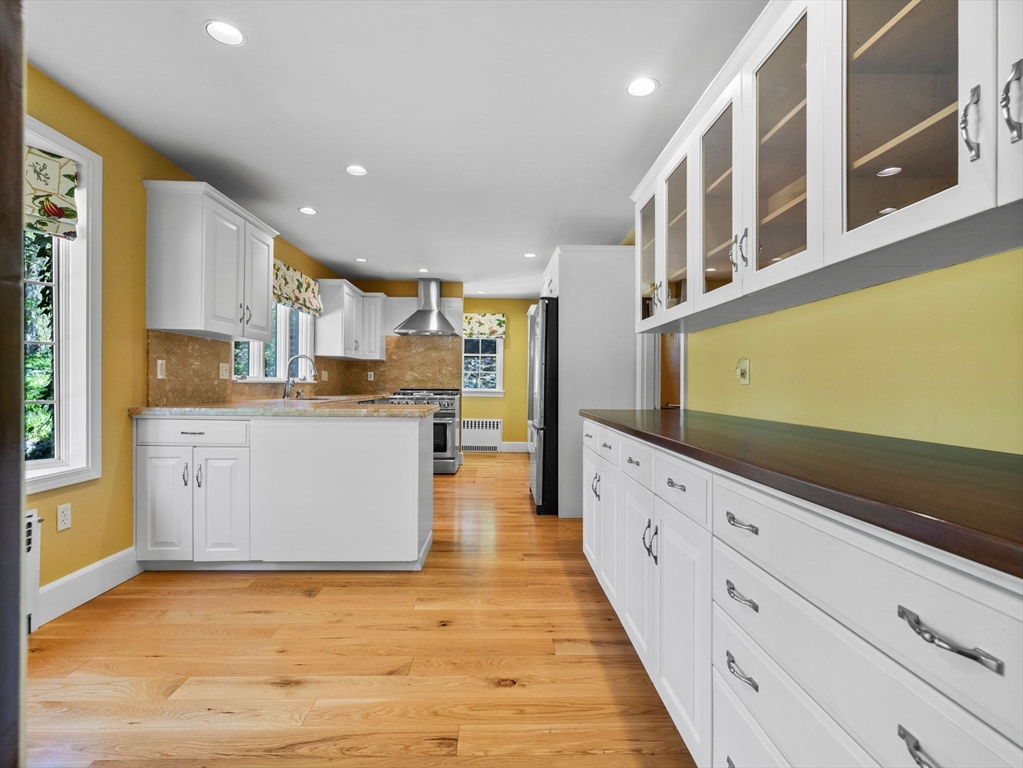 81 Garden Road Wellesley, MA 02481 - Photo 6 of 17 a large white kitchen with cabinets