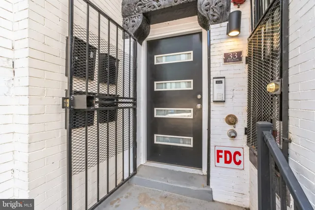 a view of a brick building with many windows