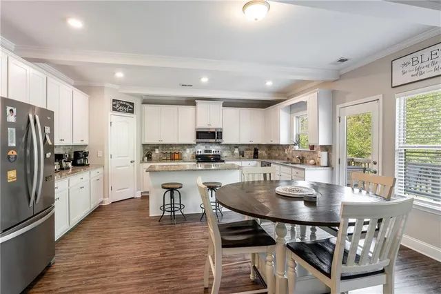 a bedroom with furniture and a flat screen tv
