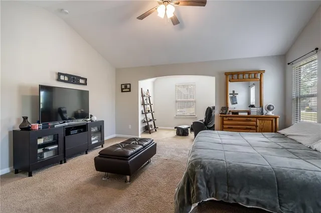 a bathroom with a double vanity sink a mirror and a bathtub