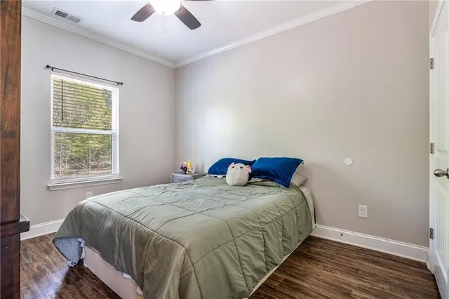 a view of walk in closet with clothes
