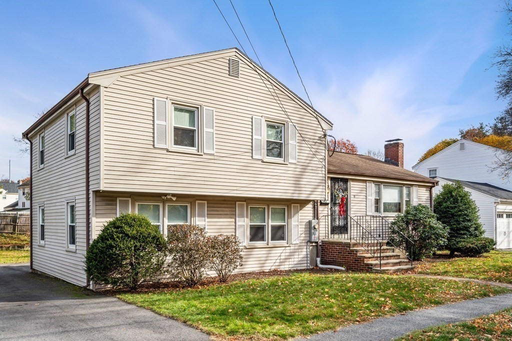 11 Christopher Drive Milton, MA 02186 - Photo 2 of 34 a front view of a house with garden