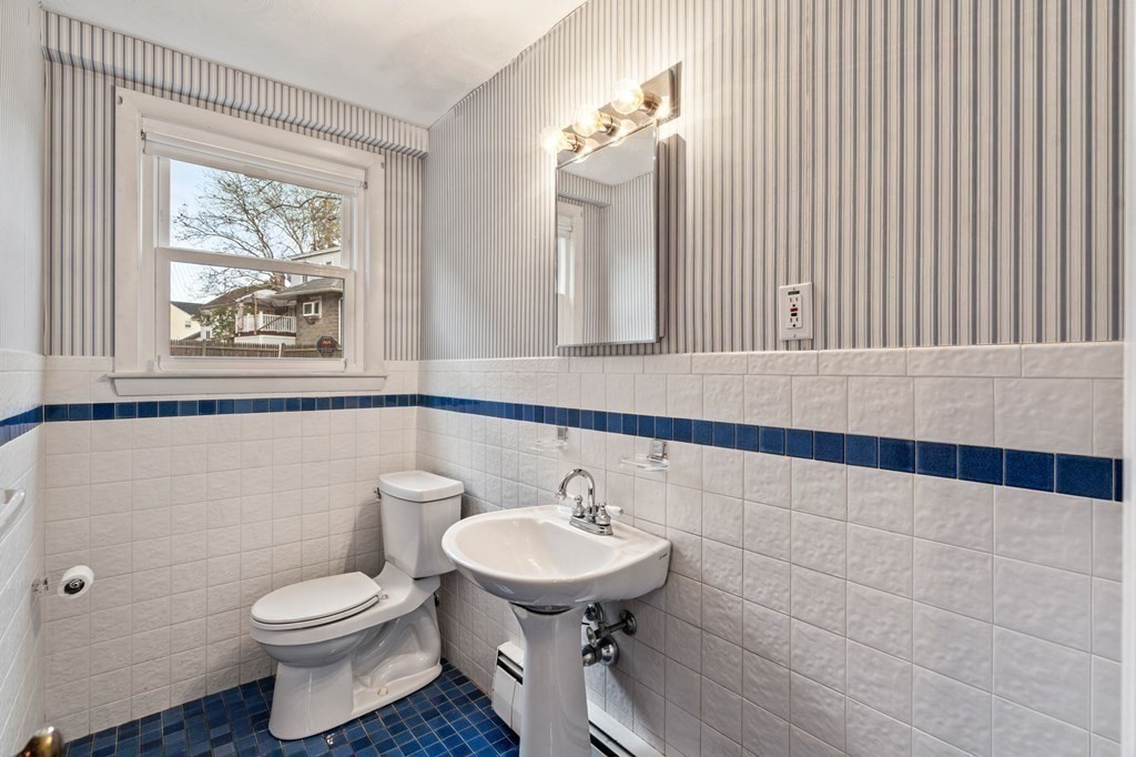 11 Christopher Drive Milton, MA 02186 - Photo 22 of 34 a bathroom with a toilet a sink and mirror