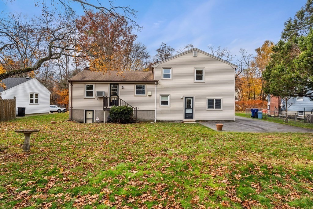 11 Christopher Drive Milton, MA 02186 - Photo 30 of 34 a view of a white house with a yard