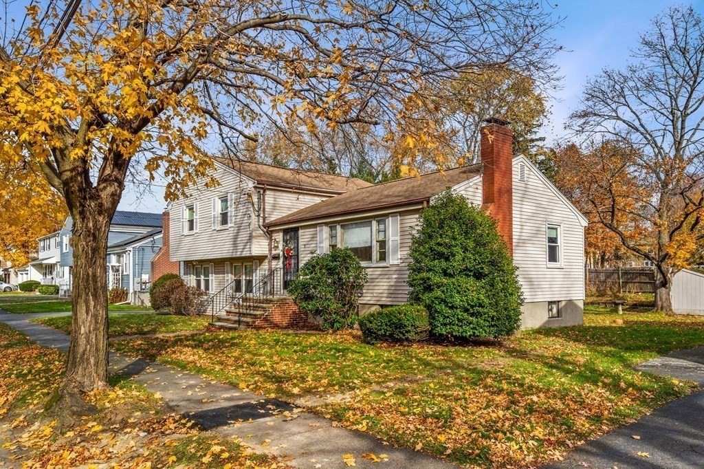 11 Christopher Drive Milton, MA 02186 - Photo 3 of 34 a front view of a house with a yard