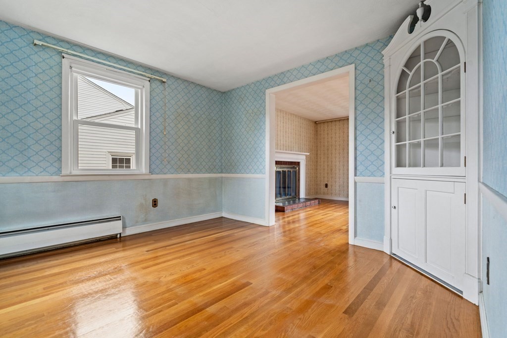 11 Christopher Drive Milton, MA 02186 - Photo 8 of 34 wooden floor in an empty room with a window