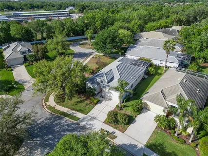 an aerial view of a house with outdoor space