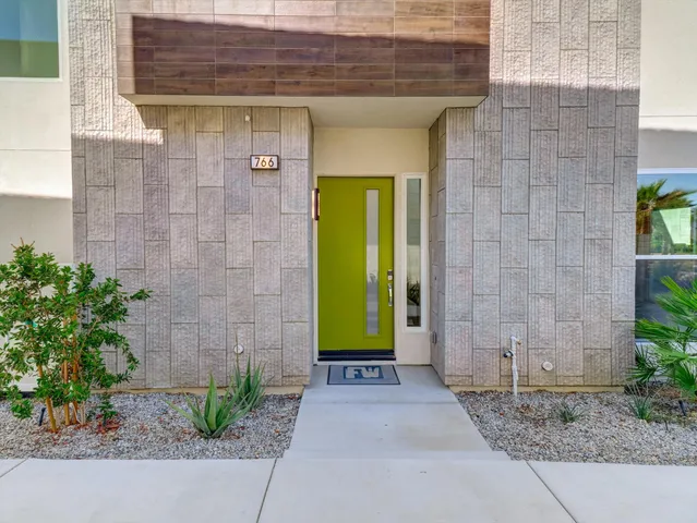 a kitchen with kitchen island granite countertop a sink and a stove