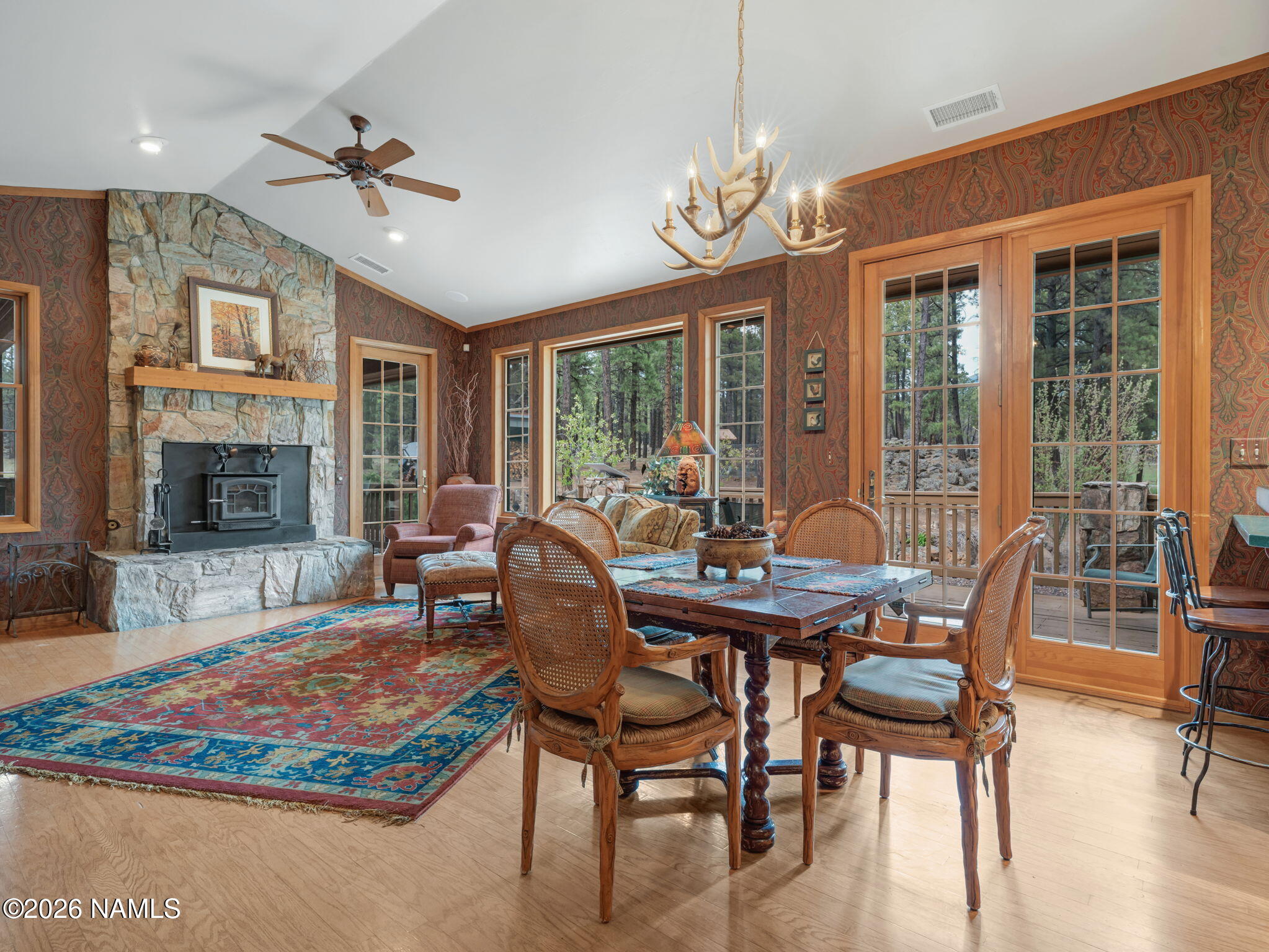 5415 North Fort Valley Road Flagstaff, AZ 86001 - Photo 11 of 64 a view of a dining room with furniture a chandelier and wooden floor