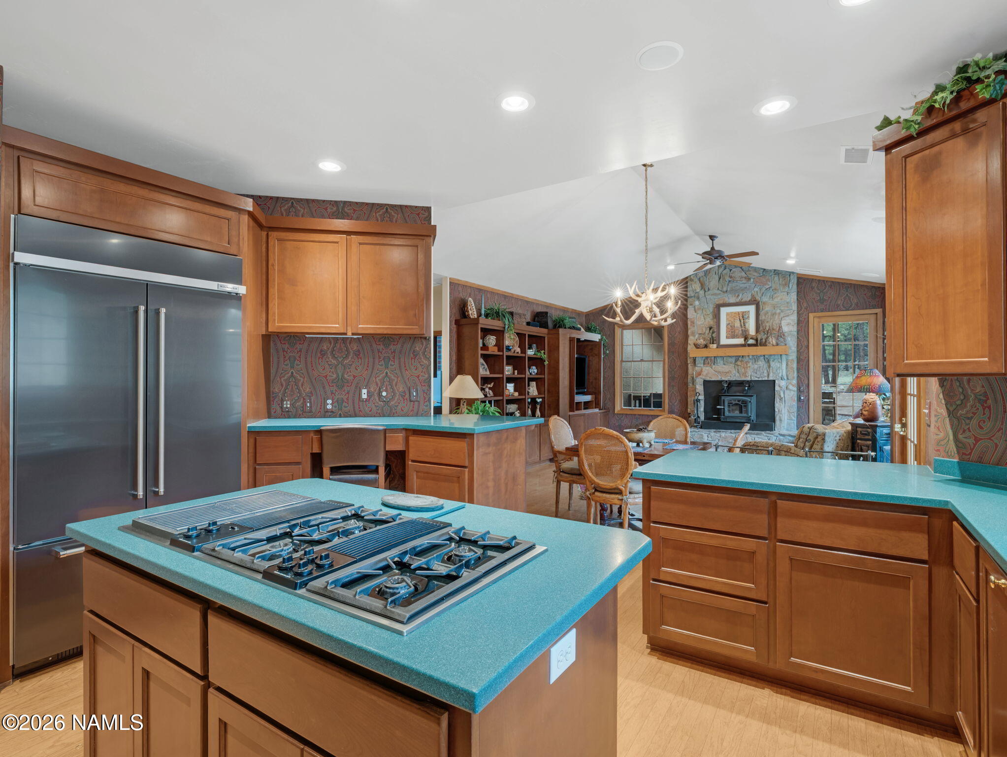 5415 North Fort Valley Road Flagstaff, AZ 86001 - Photo 19 of 64 a kitchen with kitchen island granite countertop a sink cabinets and stainless steel appliances