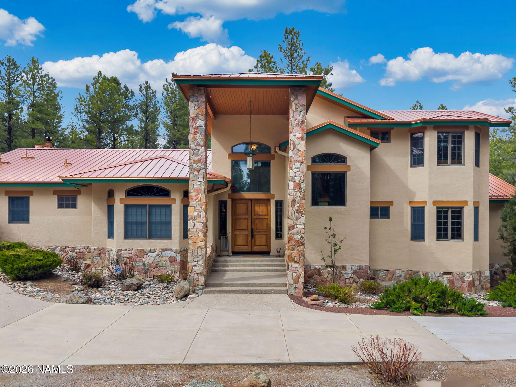 5415 North Fort Valley Road Flagstaff, AZ 86001 - Photo 2 of 64 a front view of a house with a yard