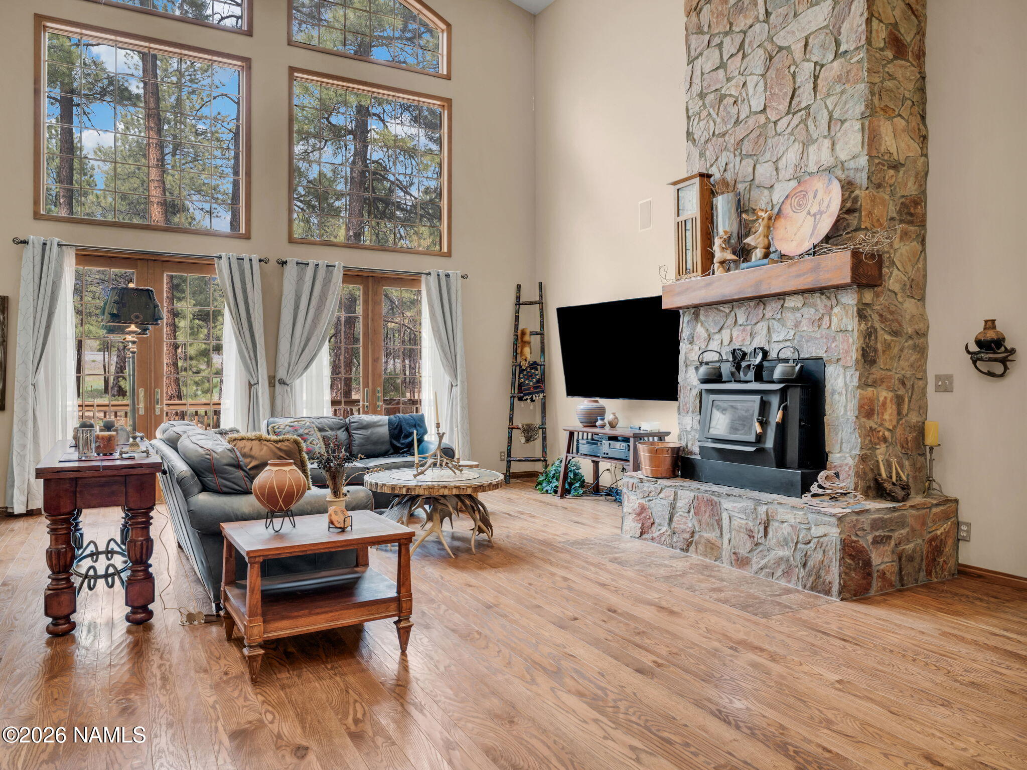 5415 North Fort Valley Road Flagstaff, AZ 86001 - Photo 22 of 64 a living room with furniture a fireplace and a flat screen tv