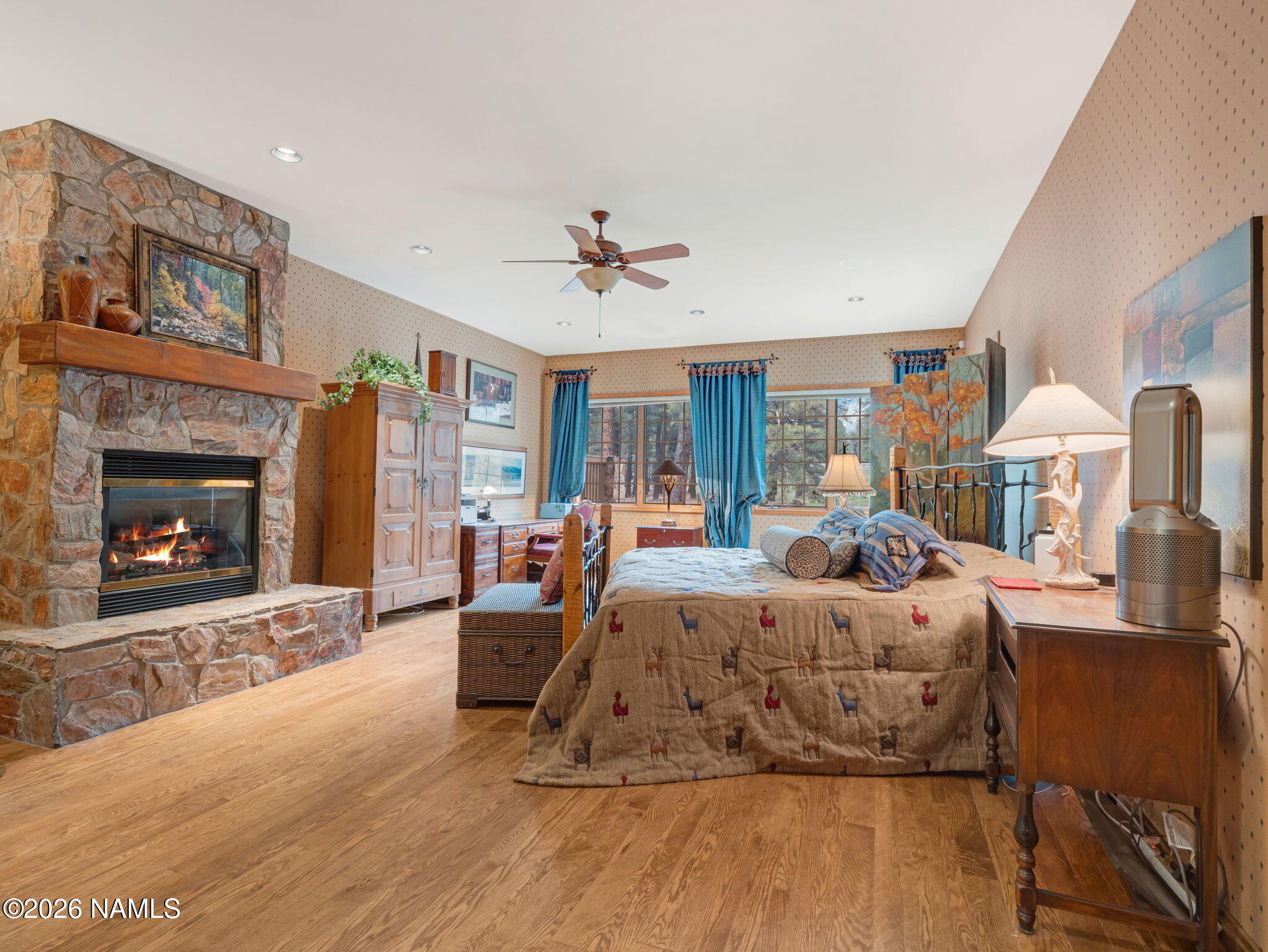 5415 North Fort Valley Road Flagstaff, AZ 86001 - Photo 28 of 64 a bed room with a bed and a fireplace