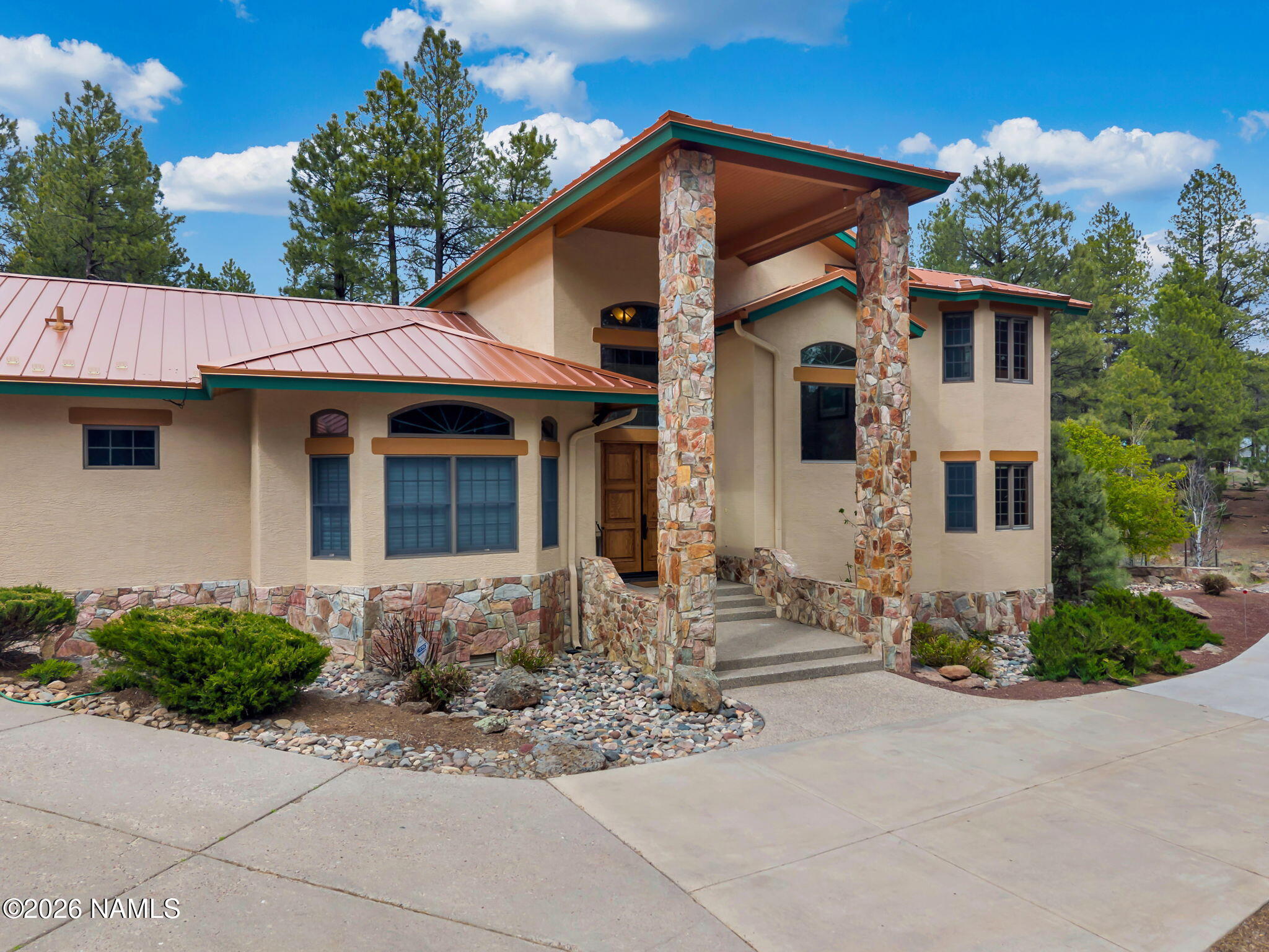5415 North Fort Valley Road Flagstaff, AZ 86001 - Photo 3 of 64 a front view of a house with a yard