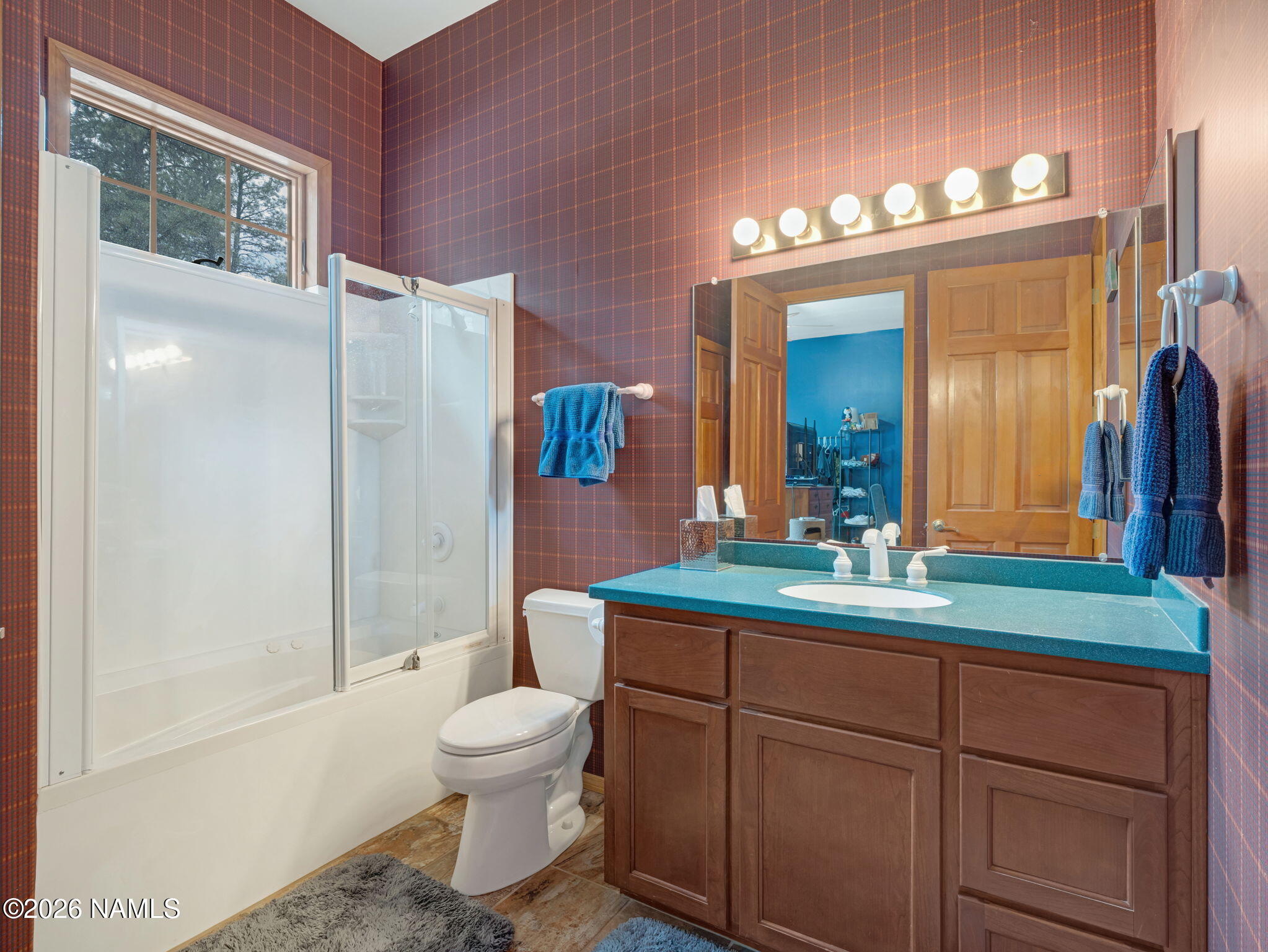 5415 North Fort Valley Road Flagstaff, AZ 86001 - Photo 34 of 64 a bathroom with a toilet a sink and a large mirror