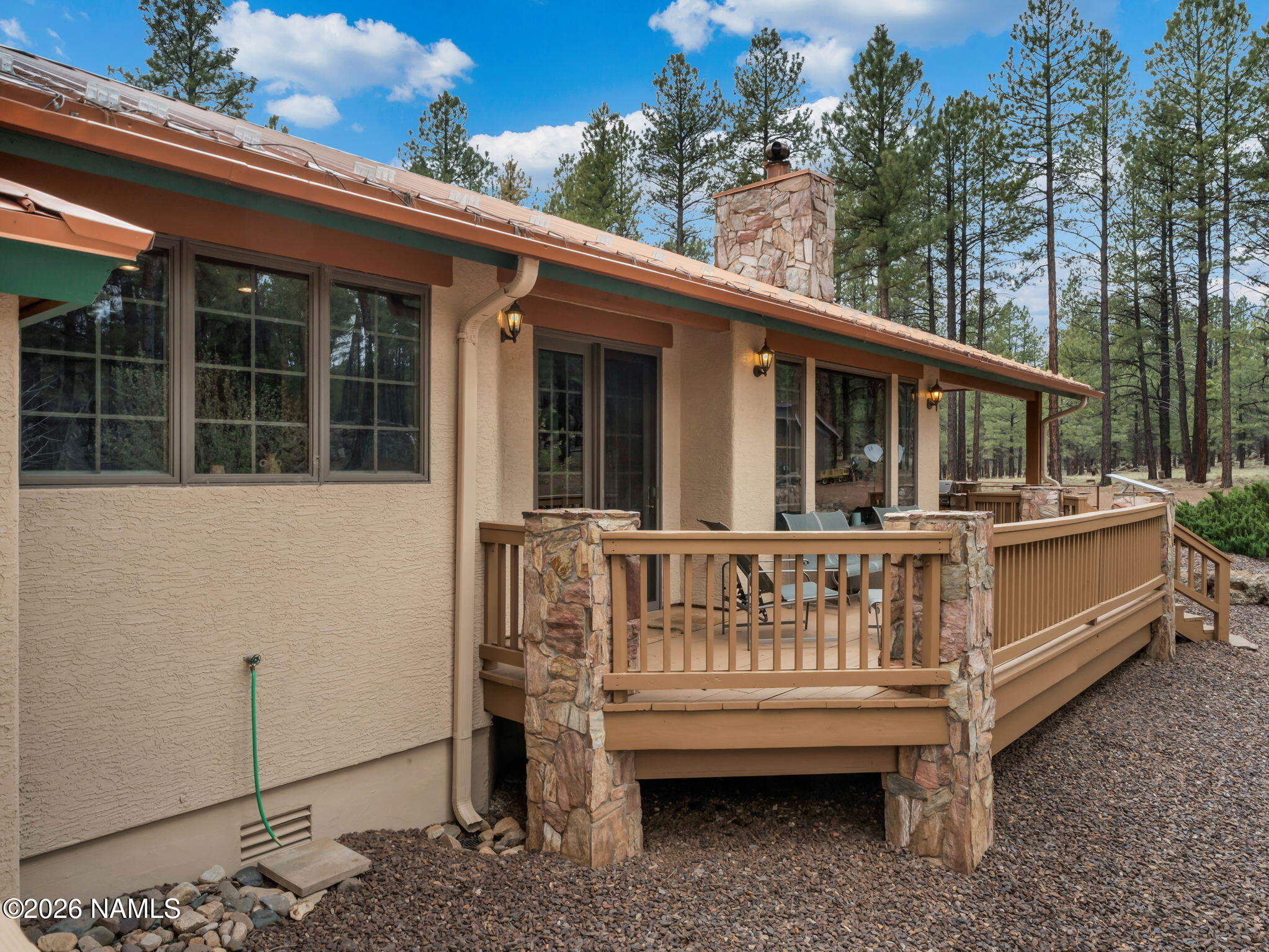 5415 North Fort Valley Road Flagstaff, AZ 86001 - Photo 40 of 64 a view of a house with backyard outdoor seating and deck