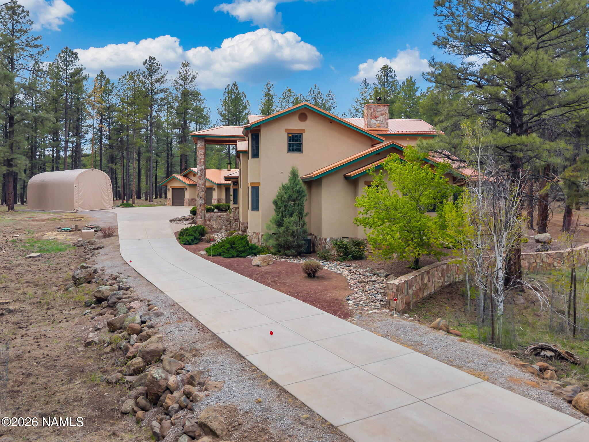 5415 North Fort Valley Road Flagstaff, AZ 86001 - Photo 4 of 64 a view of a house with backyard and trees