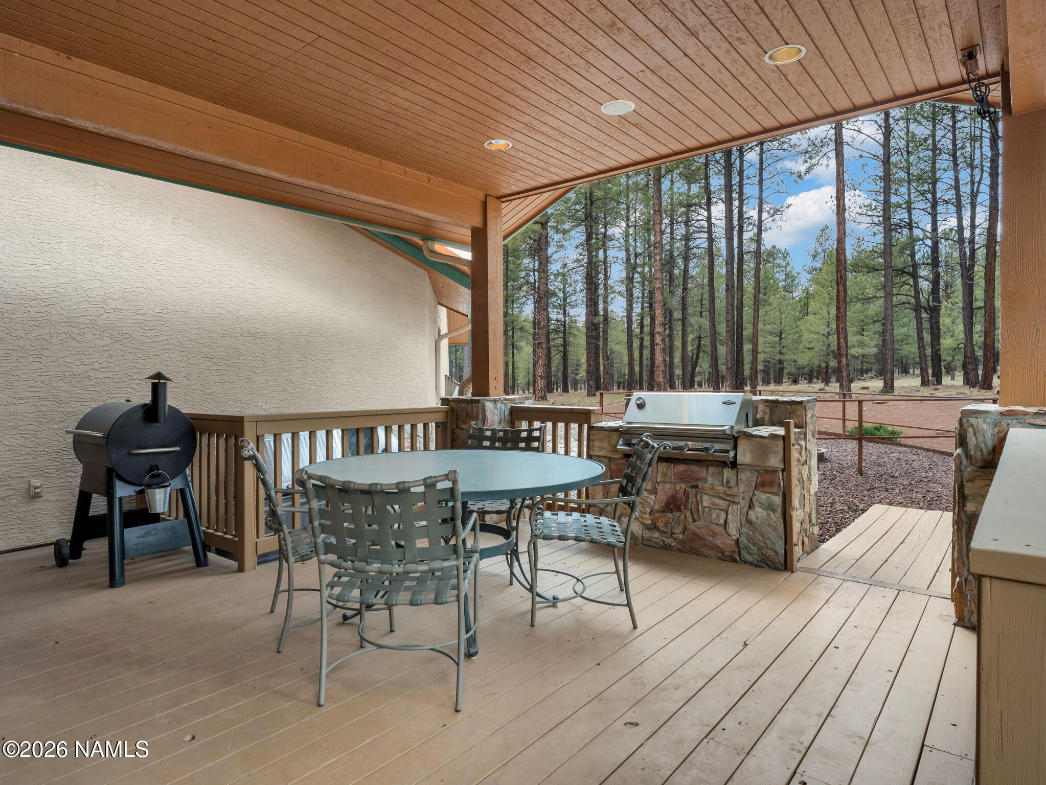 5415 North Fort Valley Road Flagstaff, AZ 86001 - Photo 42 of 64 a view of a dining room with furniture large windows and wooden floor