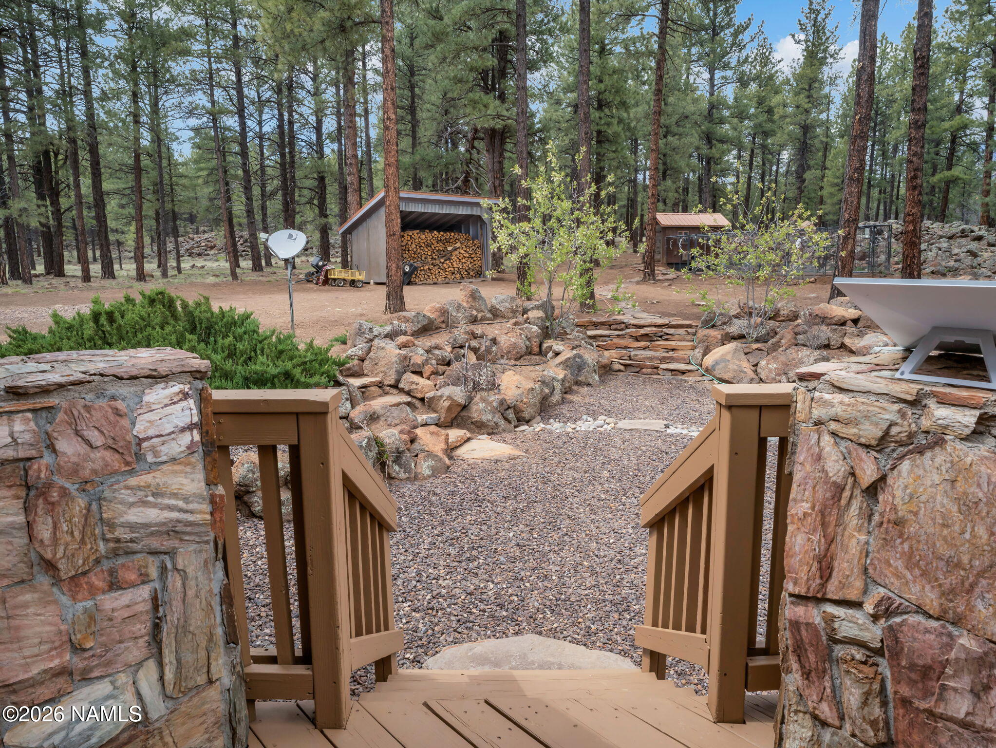 5415 North Fort Valley Road Flagstaff, AZ 86001 - Photo 43 of 64 a view of a house with backyard and sitting area