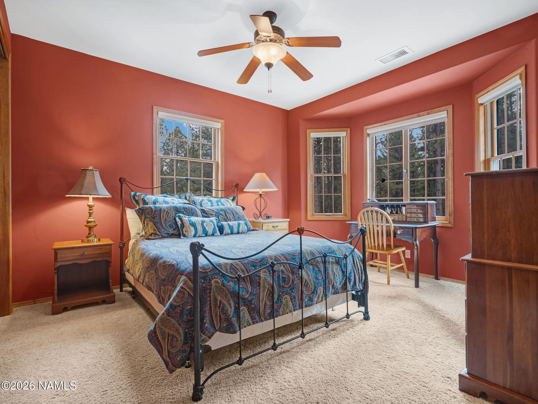 5415 North Fort Valley Road Flagstaff, AZ 86001 - Photo 44 of 64 a bedroom with a bed and a chandelier