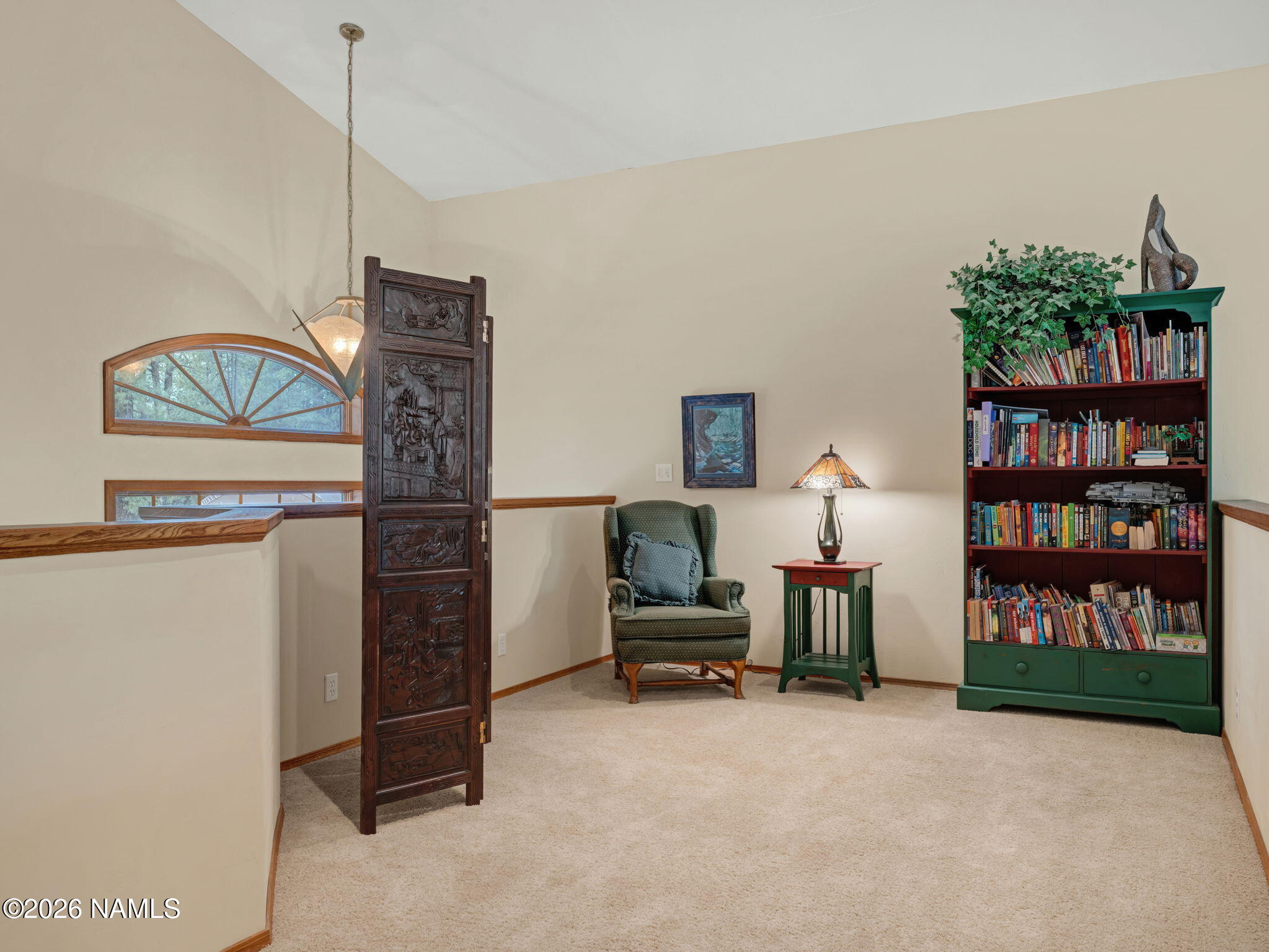 5415 North Fort Valley Road Flagstaff, AZ 86001 - Photo 49 of 64 a living room with furniture a bookshelf and a window