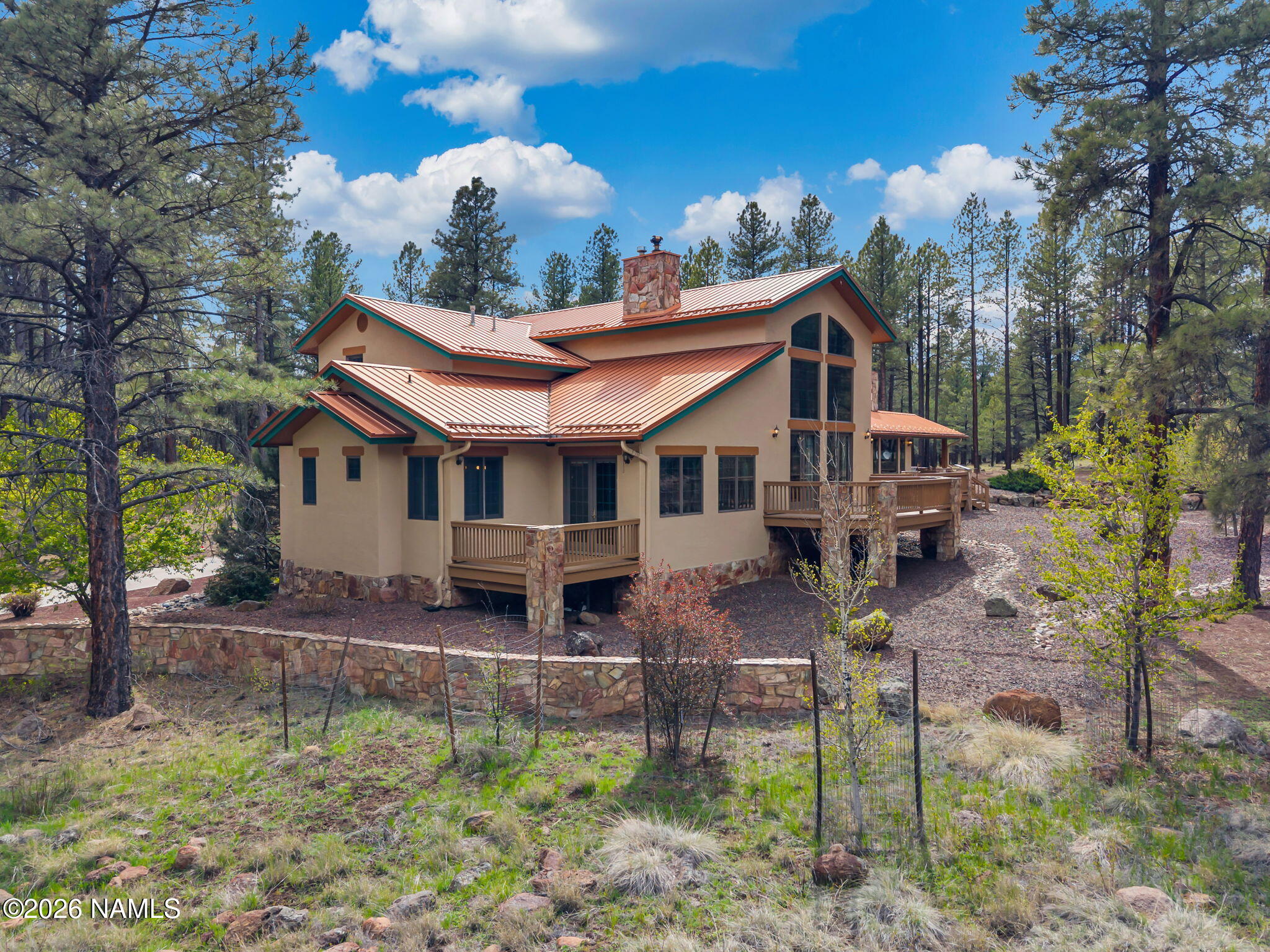 5415 North Fort Valley Road Flagstaff, AZ 86001 - Photo 52 of 64 a front view of a house with garden