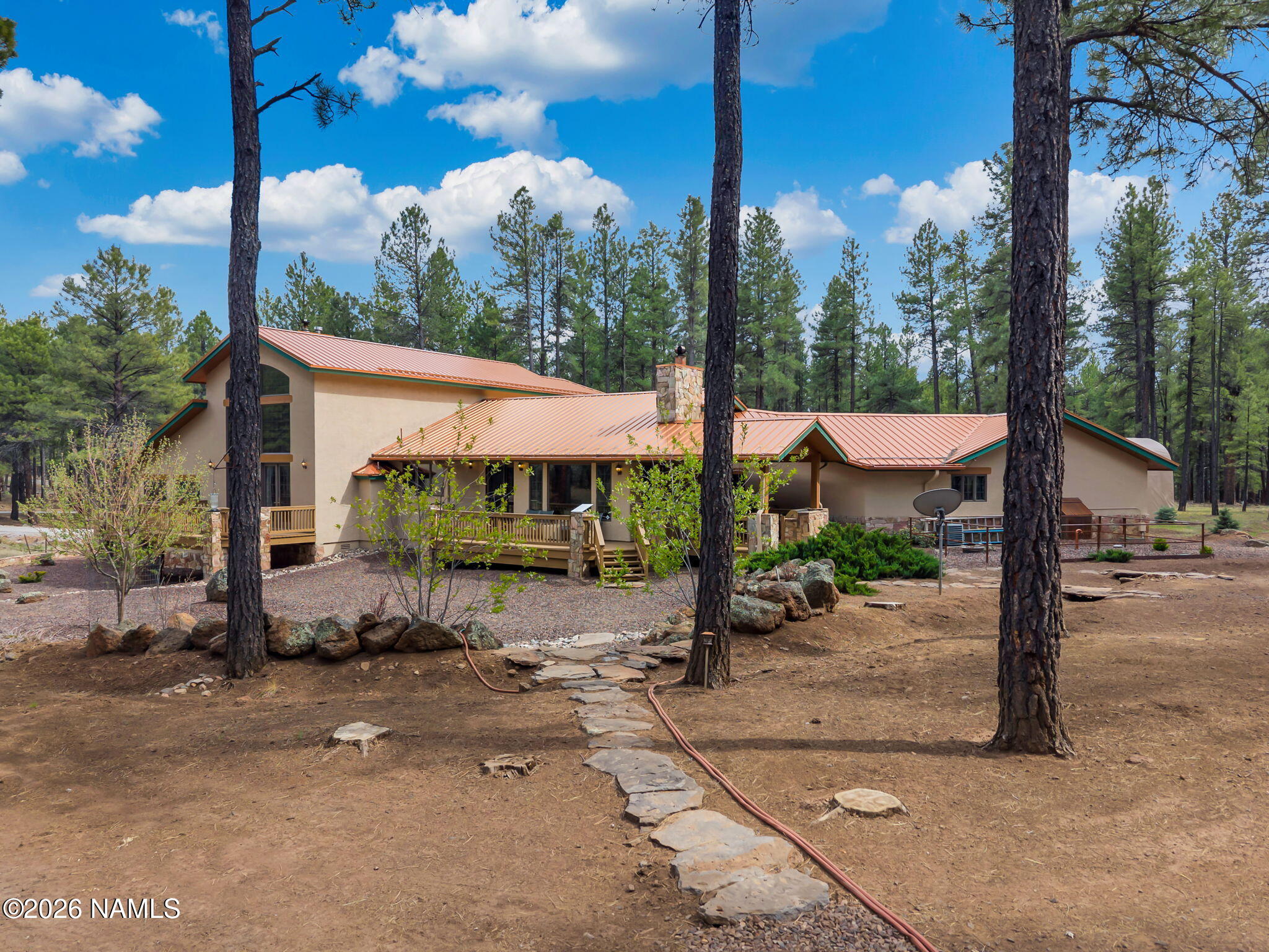 5415 North Fort Valley Road Flagstaff, AZ 86001 - Photo 54 of 64 a view of a house with backyard and a tree