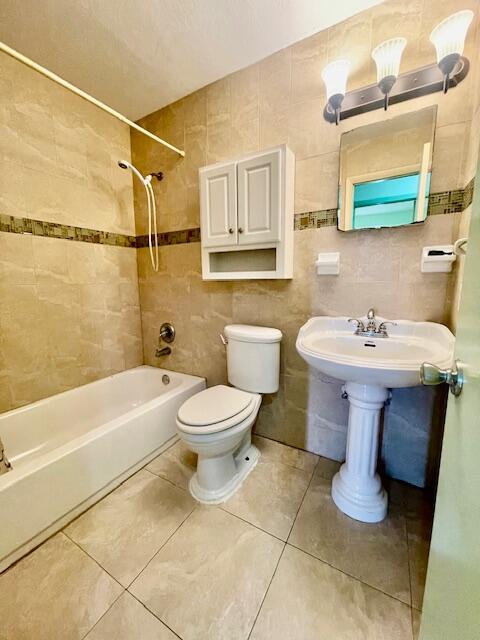 130 Mentone Road Boynton Beach, FL 33435 - Photo 18 of 26 a bathroom with a sink toilet and shower