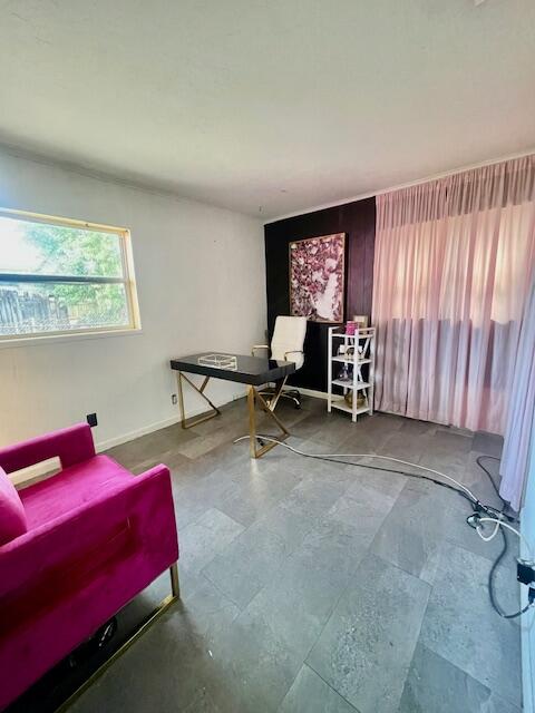 130 Mentone Road Boynton Beach, FL 33435 - Photo 23 of 26 a bedroom with a bed a table and chair