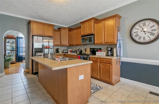 a kitchen with a cabinets and a stove top oven