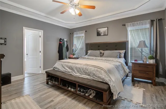 a spacious bedroom with a bed and a window