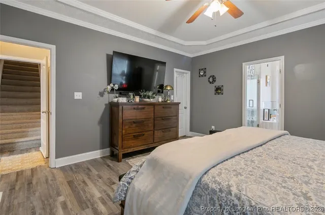 a bedroom with a bed and a television