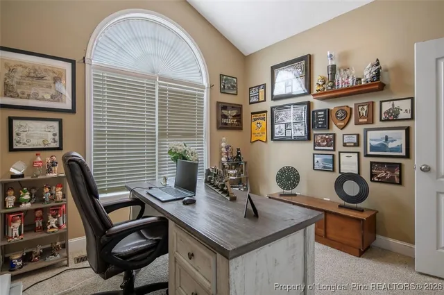 a view of a workspace with furniture