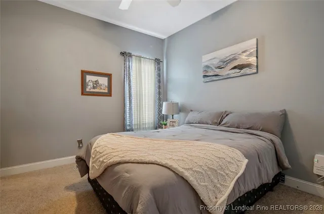 a bedroom with a bed and the wall painting