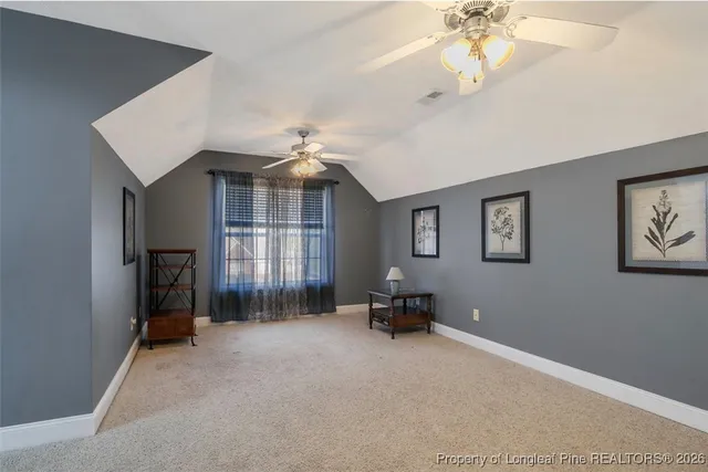 a view of livingroom with workspace and windows