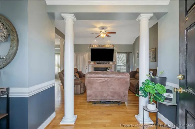 a living room with furniture and a flat screen tv