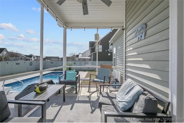 a view of chairs and tables in the balcony