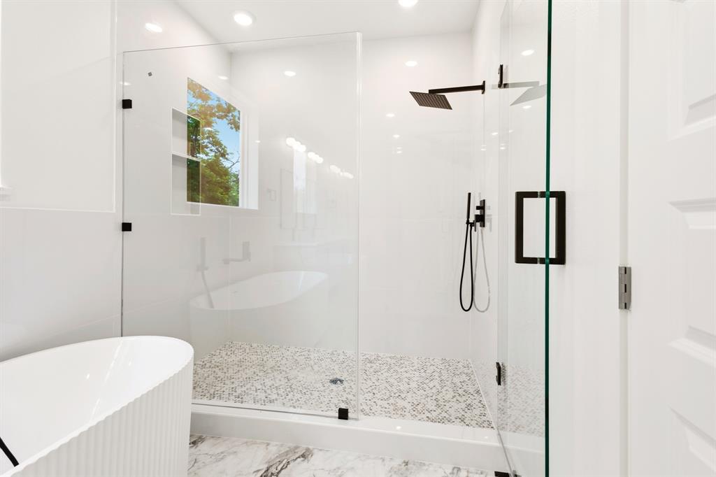 413 North Patton Avenue Dallas, TX 75203 - Photo 12 of 21 a bathroom with a bathtub and a shower