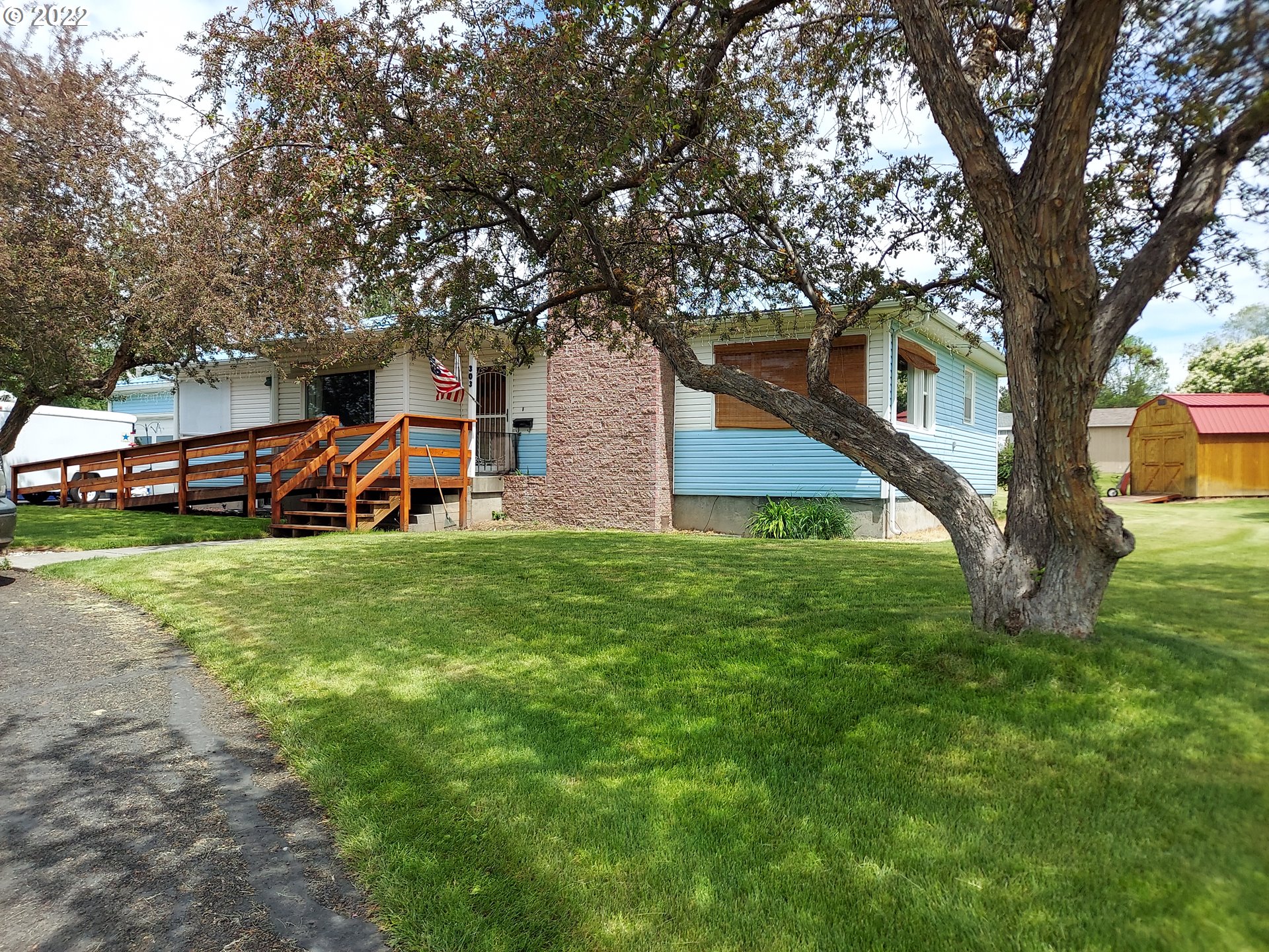 303 Northeast 2nd Street Enterprise, OR 97828 - Photo 11 of 19 a front view of a house with garden