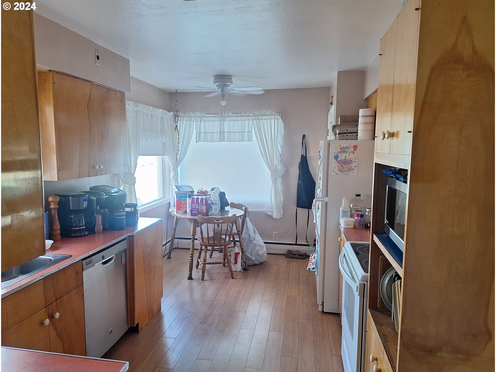 303 Northeast 2nd Street Enterprise, OR 97828 - Photo 13 of 19 a dining room with furniture and wooden floor