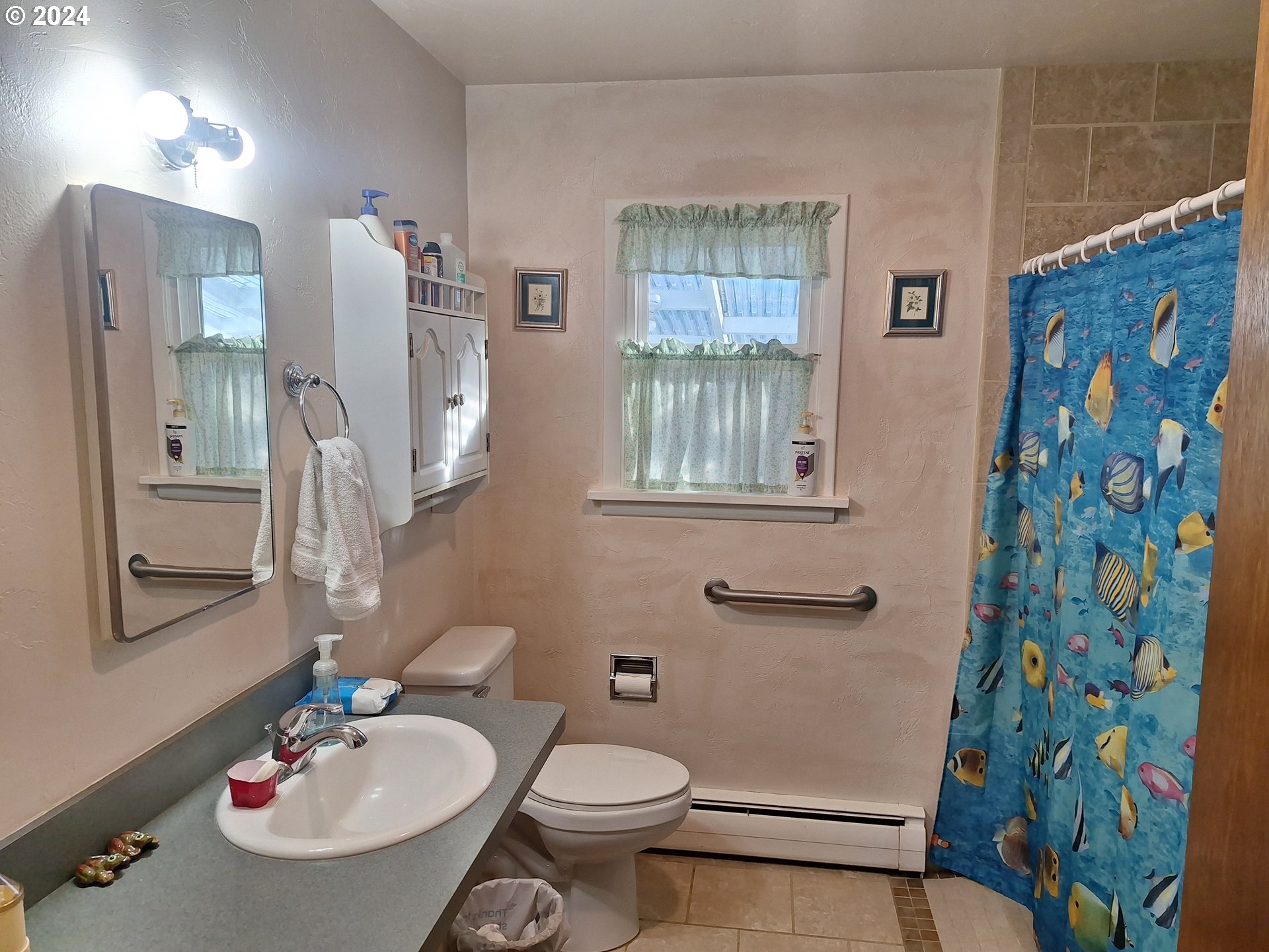 303 Northeast 2nd Street Enterprise, OR 97828 - Photo 14 of 19 a bathroom with a sink toilet and shower