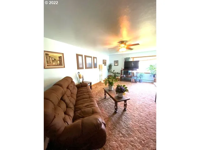 a living room with furniture and a table