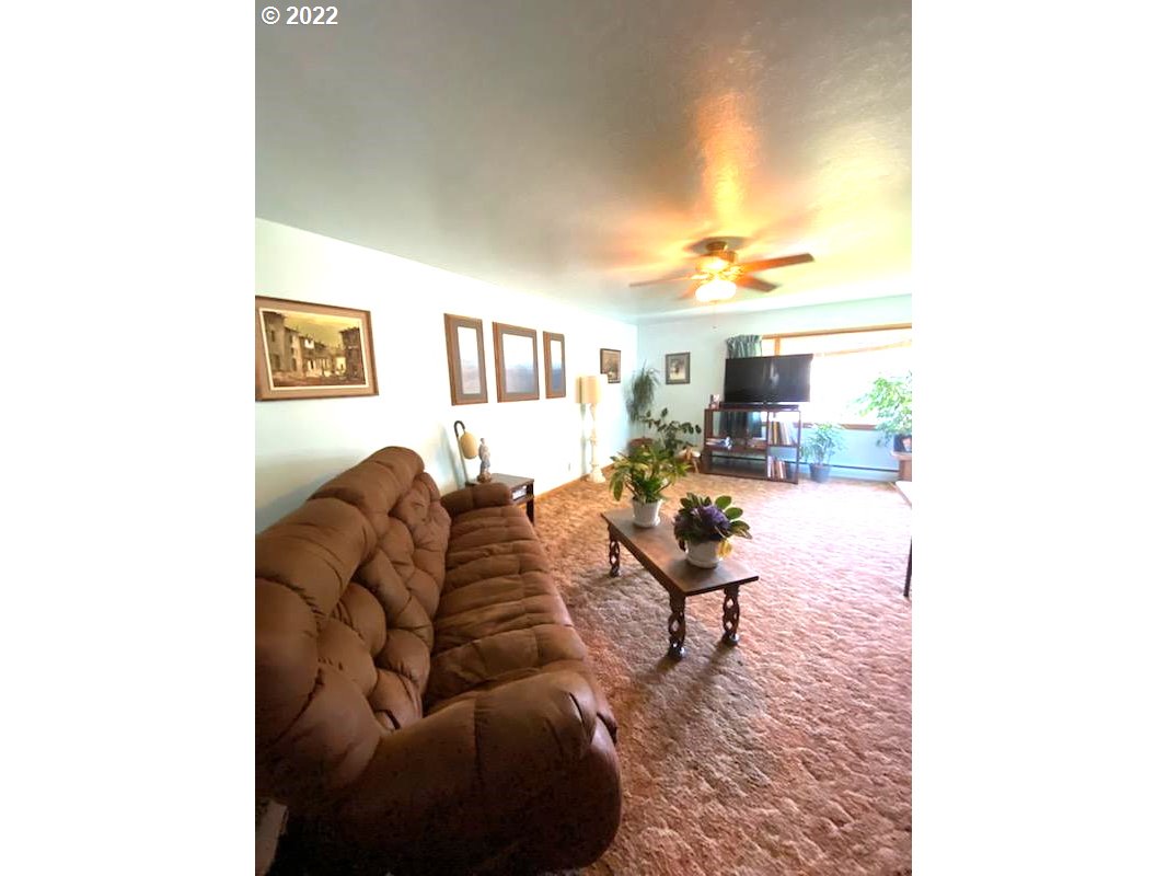 303 Northeast 2nd Street Enterprise, OR 97828 - Photo 5 of 19 a living room with furniture and a table